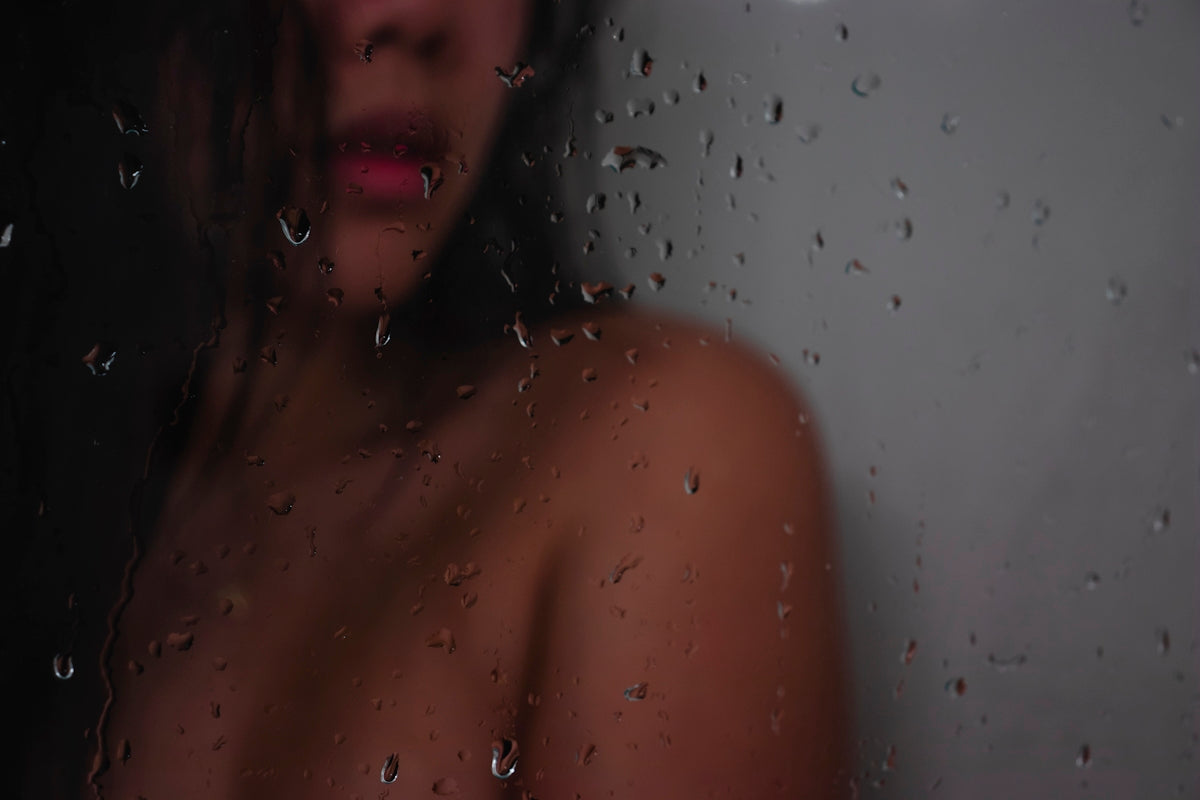 topless woman in shower room