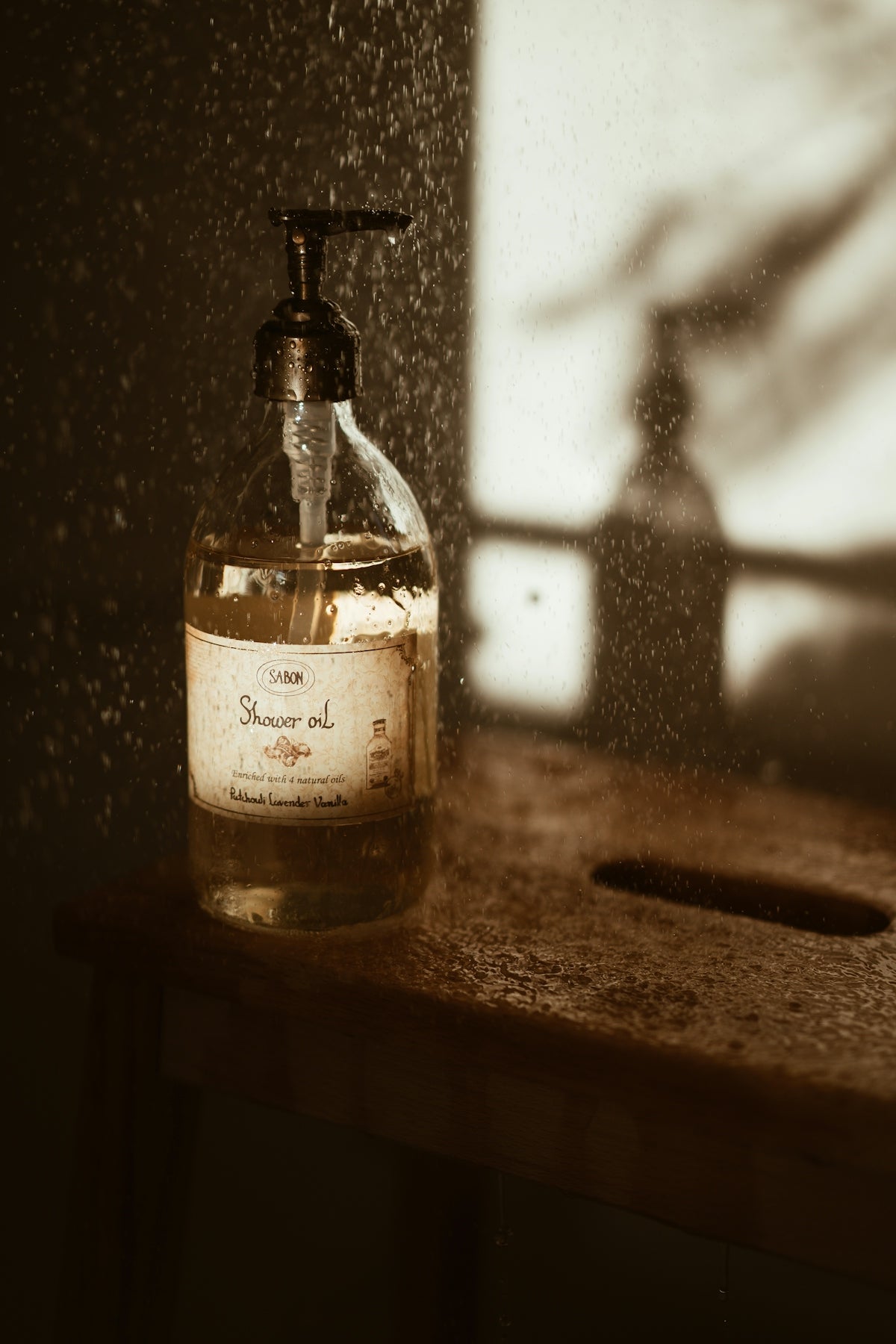 a bottle of soap sitting on top of a wooden table