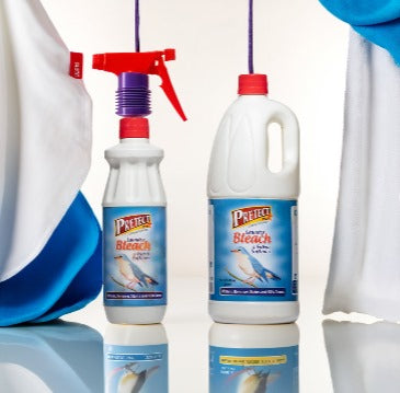Two bottles of Prell's Bleach and Bleach Free on a white background with blue accents.